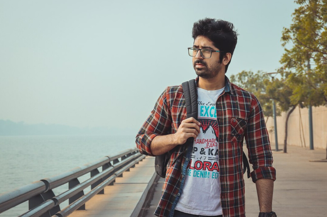 Portrait of a bearded man journalist in casual shirt