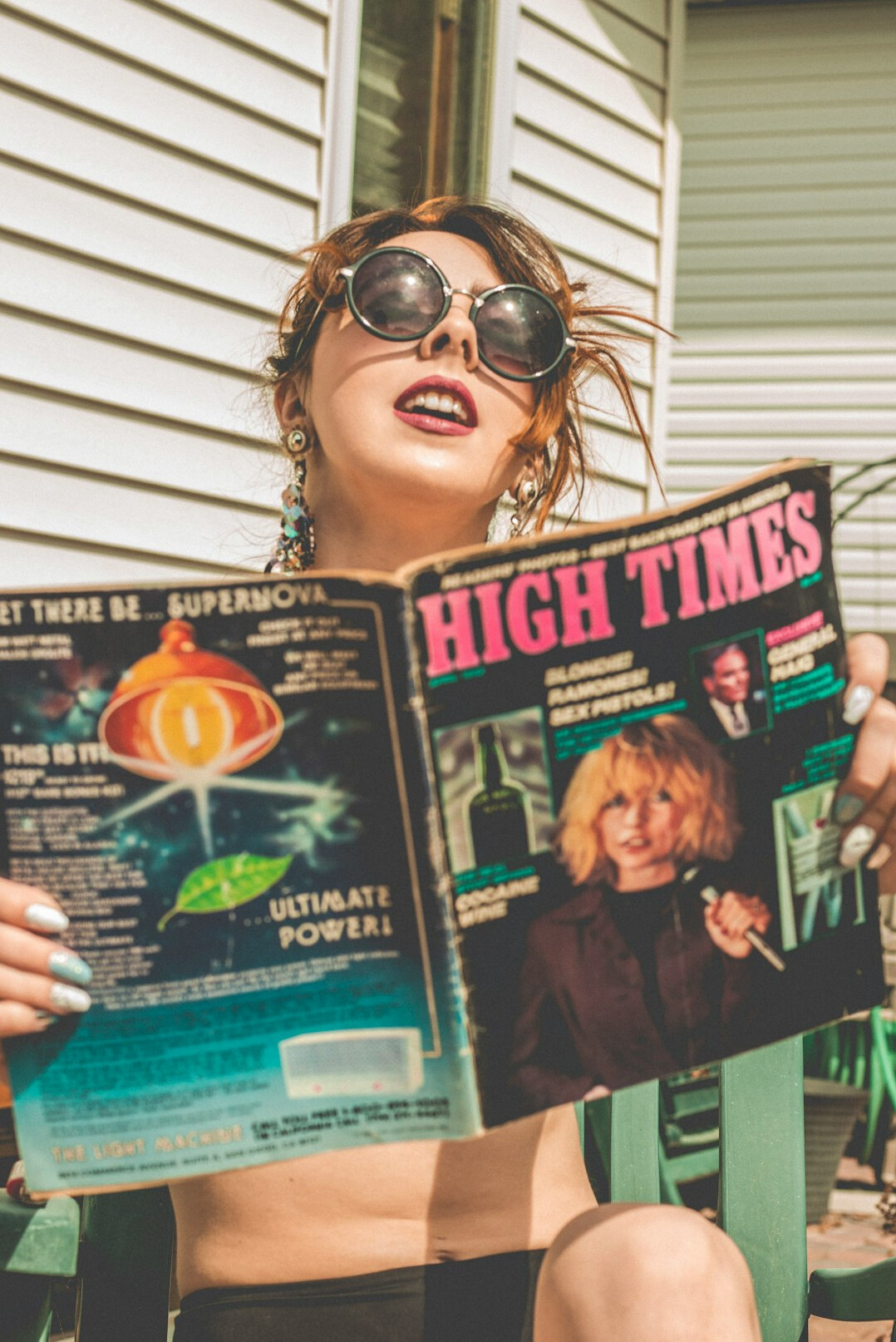 woman reading old magazine