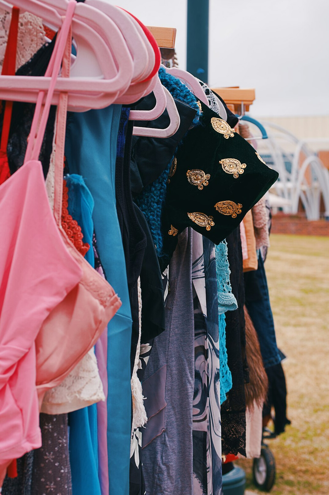 Fashion editorial clothing rack with colorful outfits