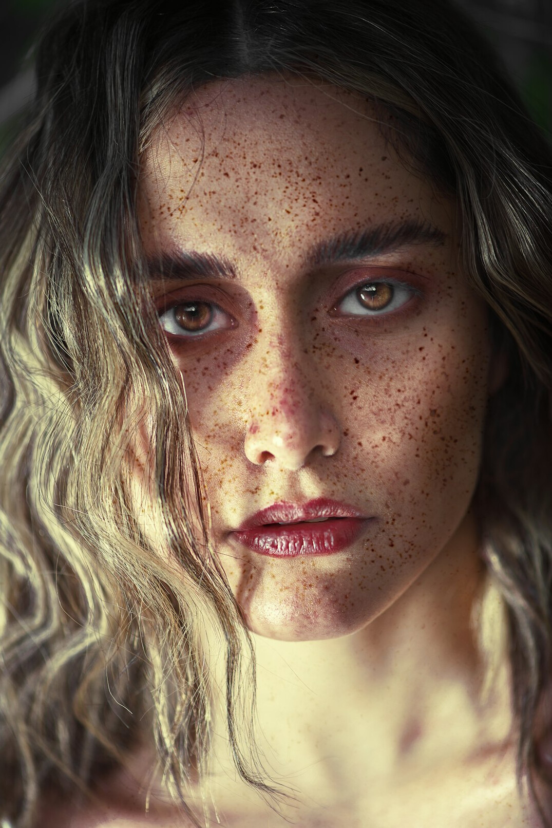 Portrait of a young woman content producer with freckles